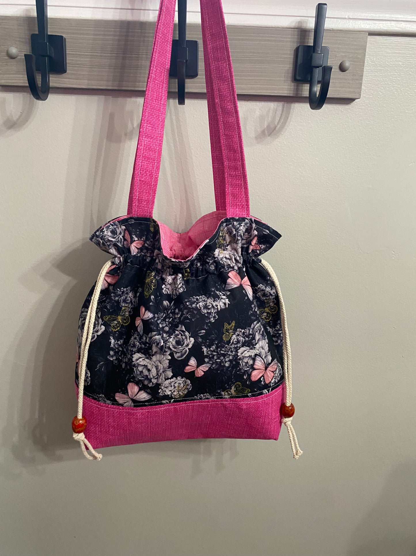 Black/pink butterfly purse with drawstring closure