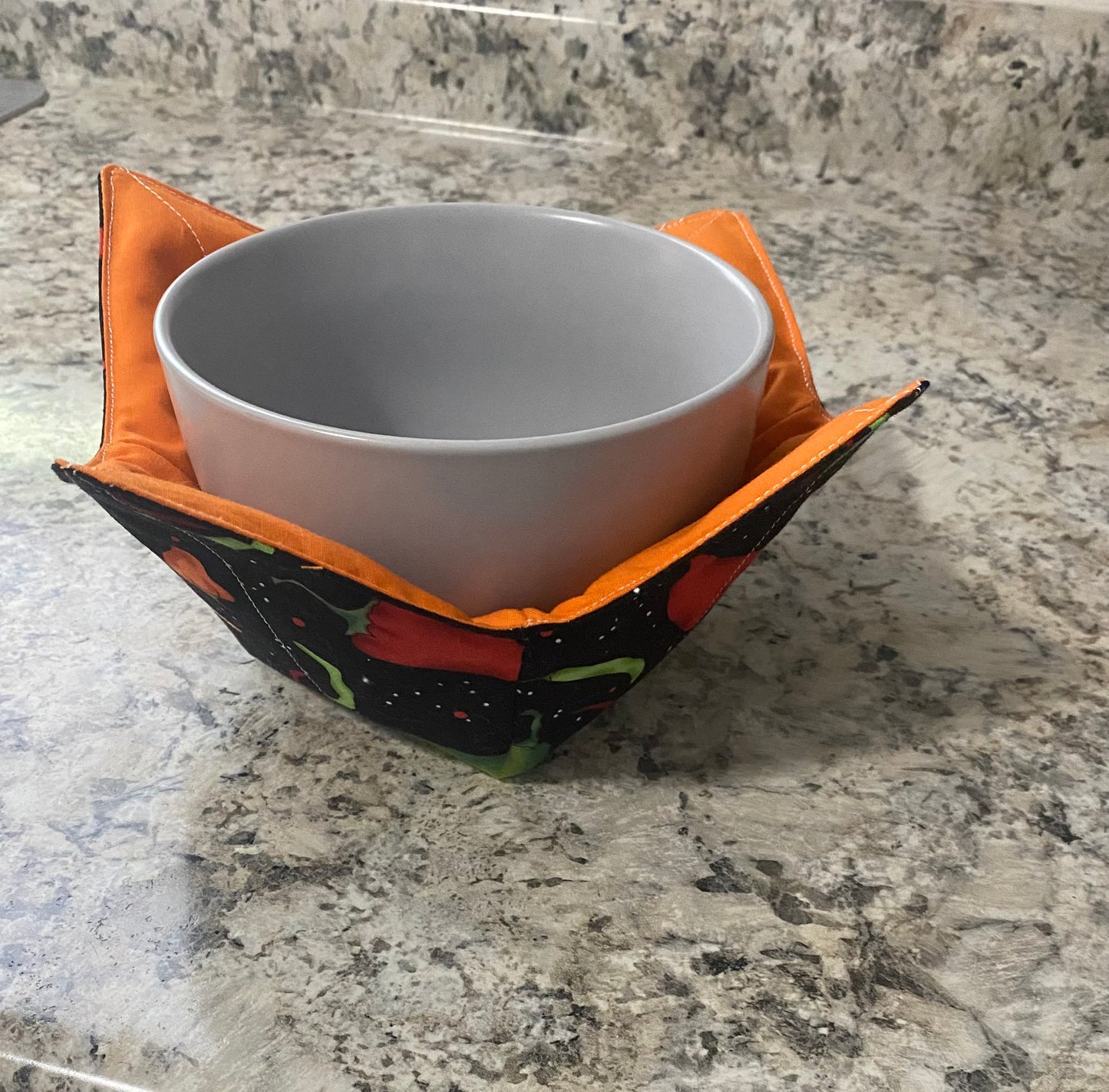 Chili peppers with orange interior bowl cozy