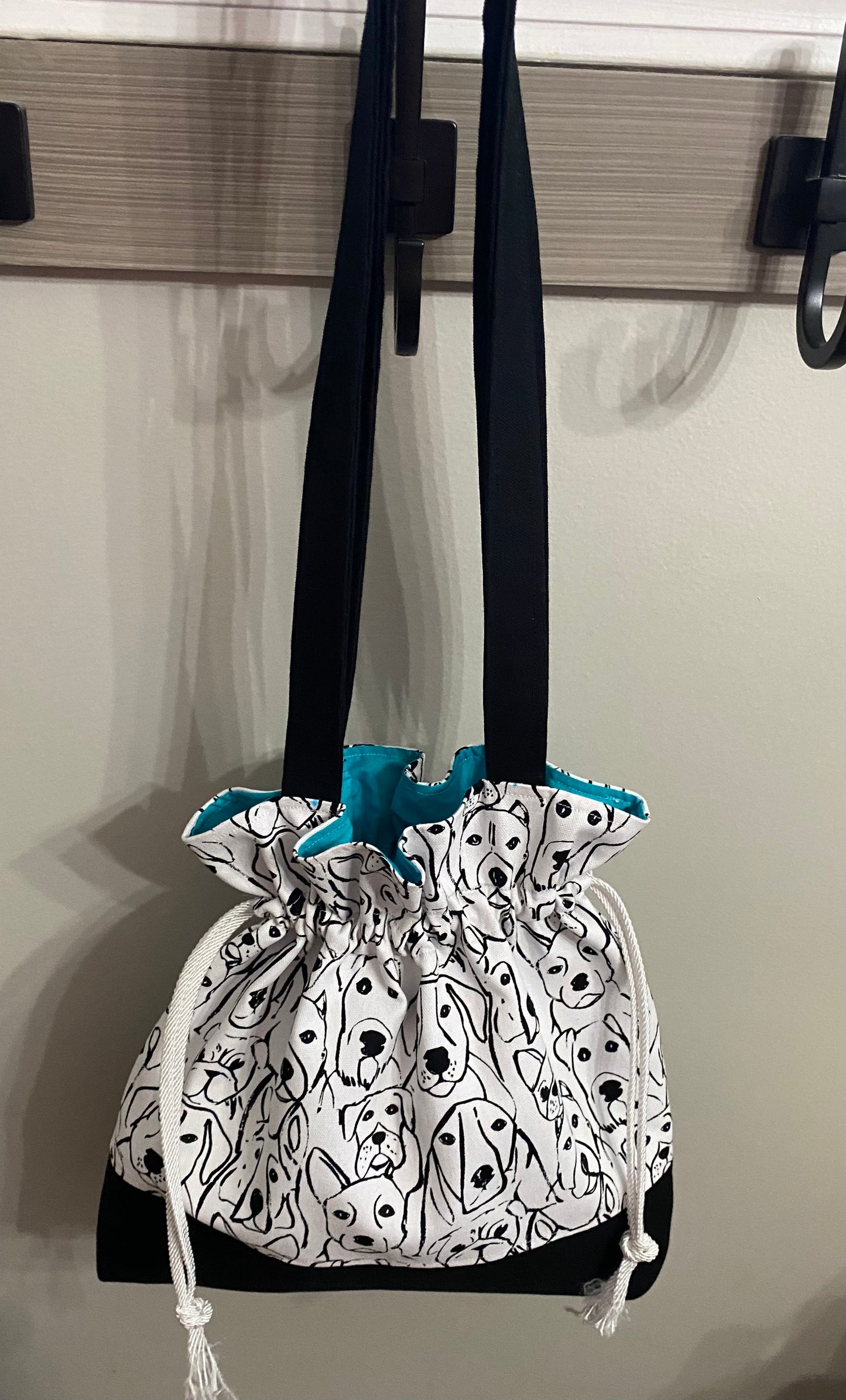 White/black doggie print with blue interior/drawstring closure