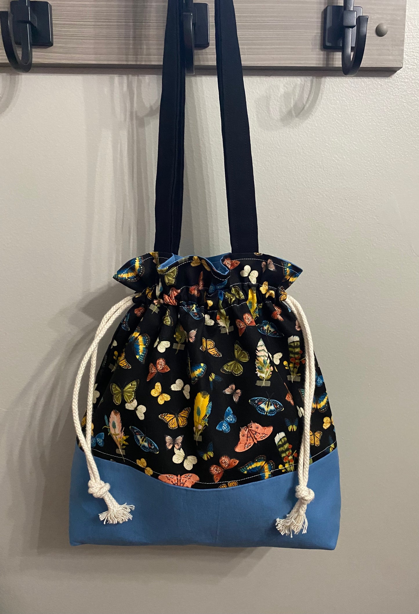 Butterfly drawstring closure purse